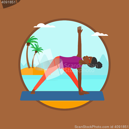 Image of Woman practicing yoga triangle pose on the beach.