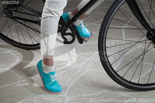 Image of Woman\'s Legs And Bicycle