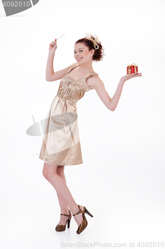 Image of Young Emotional Woman With A Gift Box