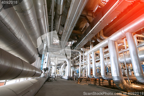 Image of Equipment, cables and piping as found inside of a modern industr