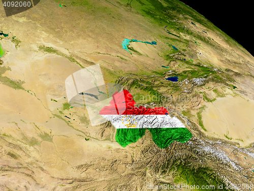 Image of Tajikistan with flag on Earth