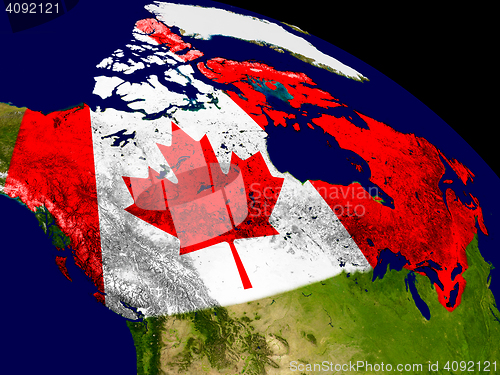 Image of Canada with flag on Earth