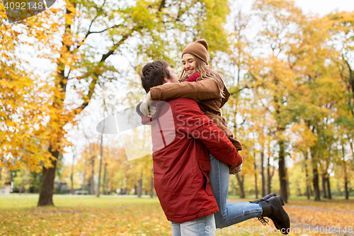 Image of happy young couple meeting in autumn park