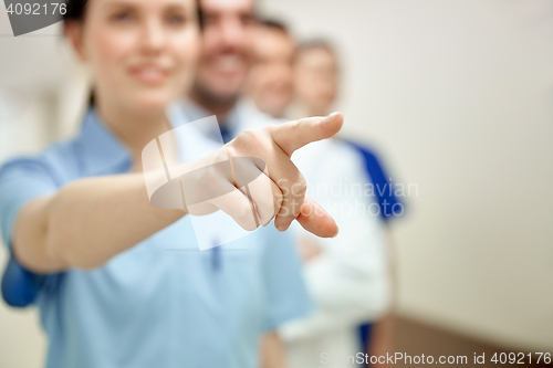 Image of close up of doctor pointing finger at hospital