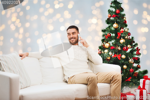 Image of man calling on smartphone for christmas