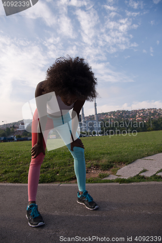 Image of Portrait of sporty young african american woman running outdoors