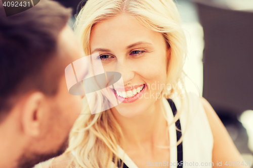 Image of happy couple faces at restaurant