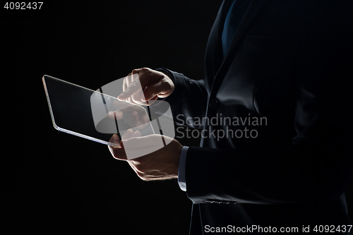 Image of close up of businessman with transparent tablet pc