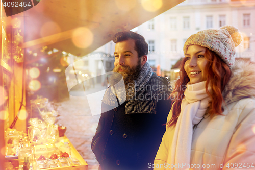 Image of happy couple walking outdoors