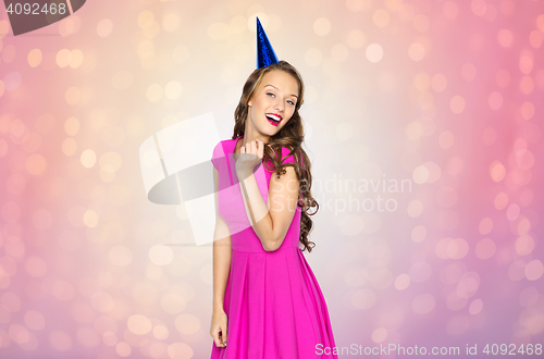 Image of happy young woman or teen girl in party cap