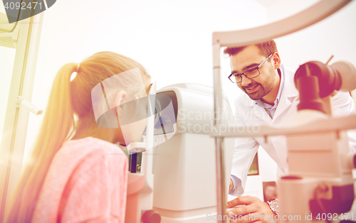 Image of optician with tonometer and patient at eye clinic