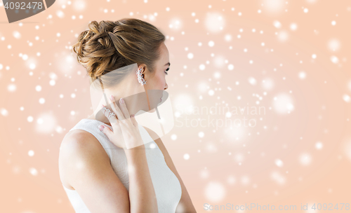 Image of close up of beautiful woman with ring and earring