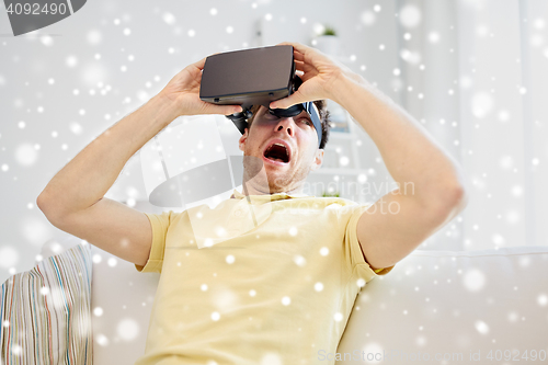 Image of young man in virtual reality headset or 3d glasses