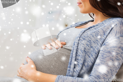 Image of close up of happy pregnant woman at home