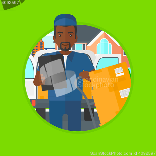 Image of Delivery man with cardboard boxes.