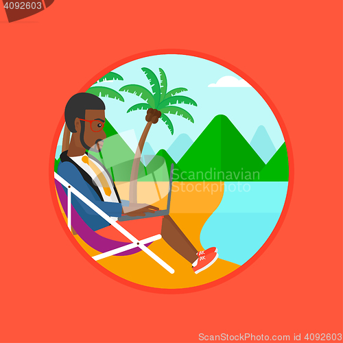 Image of Businessman working on laptop on the beach.