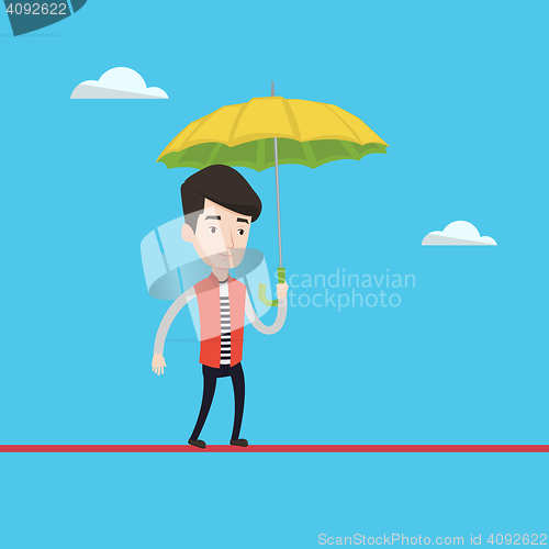 Image of Businessman balancing on a tightrope.