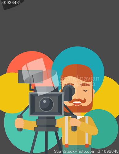 Image of Videographer and his video cam with stand.