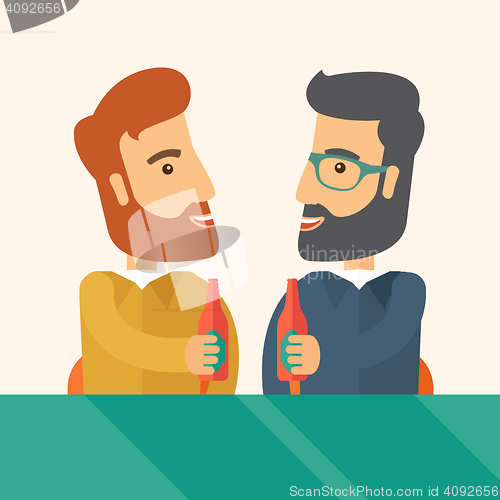 Image of Two co- workers having fun drinking beer in a pub.