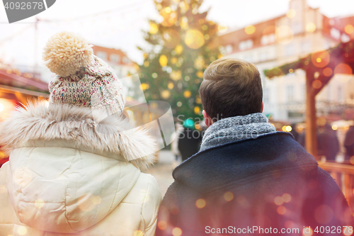 Image of close up of couple in old town at christmas