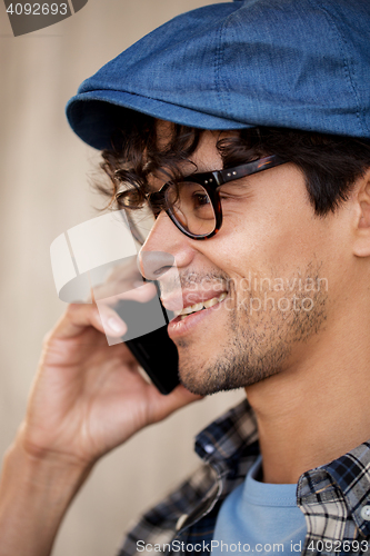 Image of close up of hipster man calling on smartphone