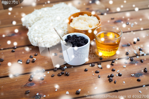 Image of homemade coffee scrub, honey and wisp on wood