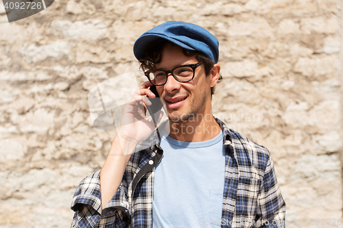 Image of close up of man calling on smartphone outdoors 