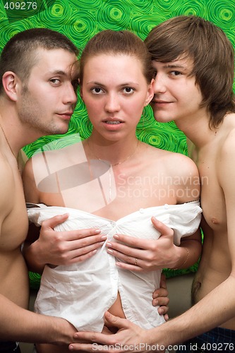 Image of Portrait of three young people at home