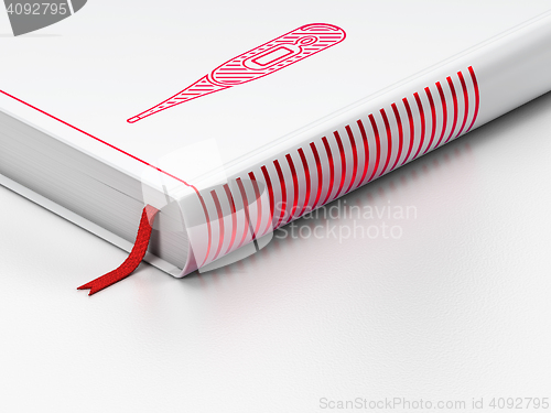 Image of Health concept: closed book, Thermometer on white background