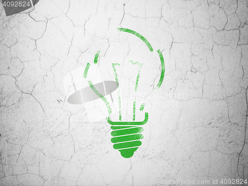 Image of Finance concept: Light Bulb on wall background