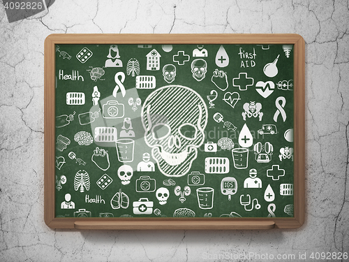 Image of Health concept: Scull on School board background