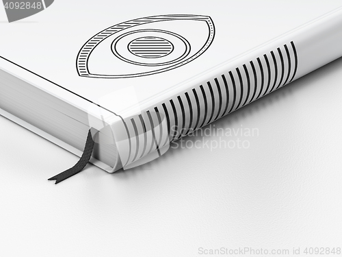 Image of Safety concept: closed book, Eye on white background