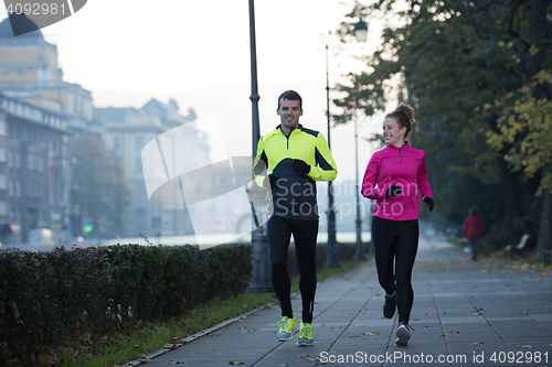 Image of young  couple jogging