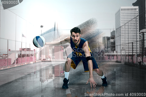 Image of Full length portrait of a basketball player with ball