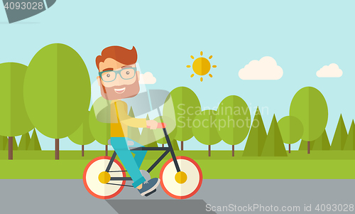 Image of Man riding a bicycle.