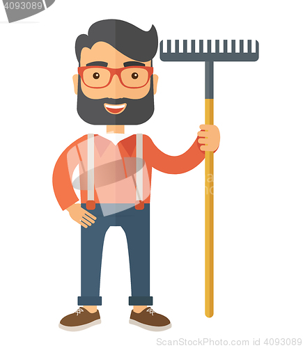 Image of Man with a mustache holding rake.