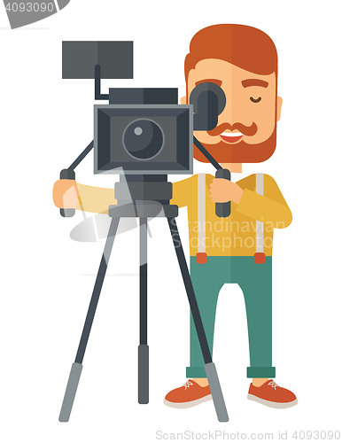 Image of Videographer and his video cam with tripod.