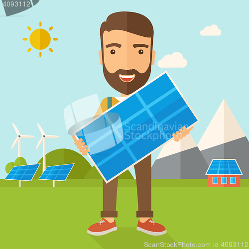 Image of Man holding a solar panel.