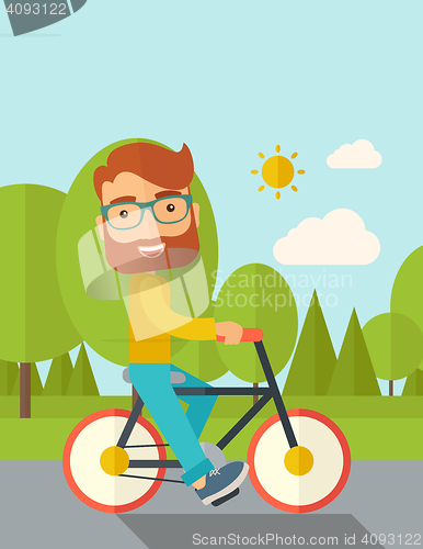 Image of Man riding a bicycle.