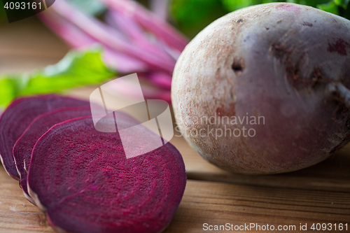 Image of close up of sliced beet on wood