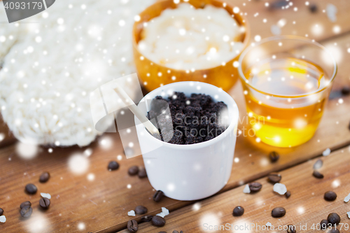 Image of coffee scrub in cup and honey on wood