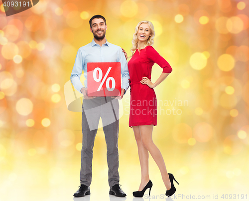 Image of happy couple with red sale sign