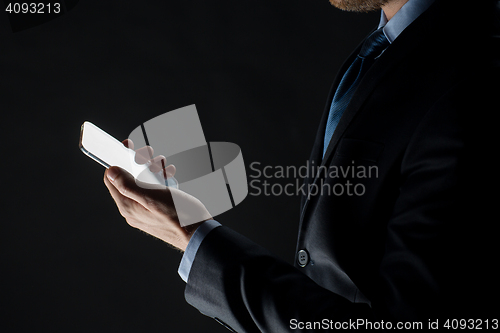 Image of close up of businessman with glass smartphone