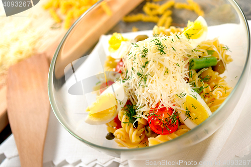Image of fresh salad whith pasta and olives