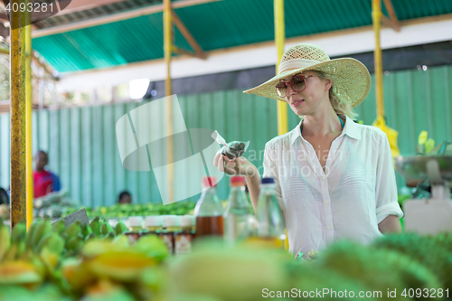 Image of Traveler shopping on traditional Victoria food market, Seychelles.