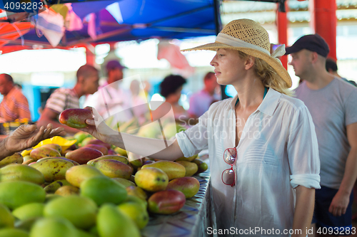 Image of Traveler shopping on traditional Victoria food market, Seychelles.