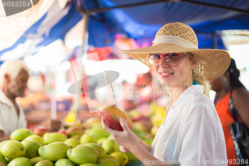 Image of Traveler shopping on traditional Victoria food market, Seychelles.