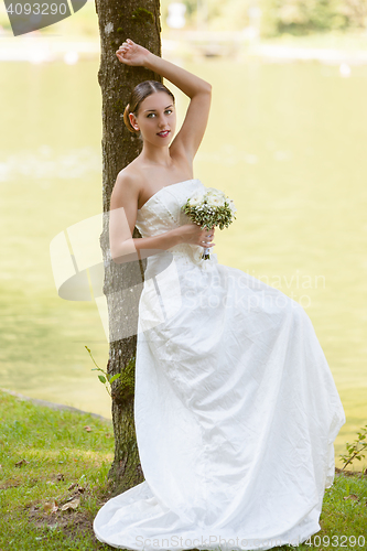 Image of remarkable bride spend free time in nature