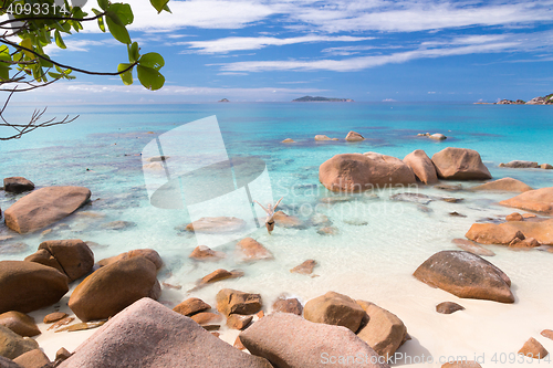 Image of Woman enjoying Anse Lazio picture perfect beach on Praslin Island, Seychelles.