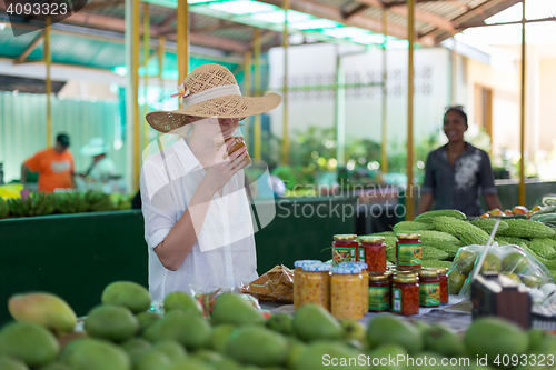 Image of Traveler shopping on traditional Victoria food market, Seychelles.